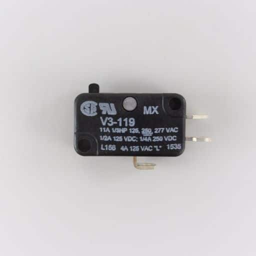 Black, plastic plunger style limit switch, part number and specifications label in English.