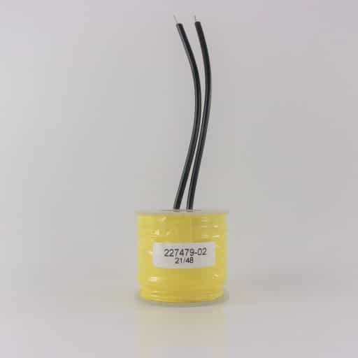 Yellow tape wrapped around wire coil, clear plastic caps on top and bottom, two black wire leads, label on front with part number 227479-02.